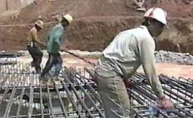 workers putting in steel foundation bars