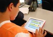 Photo of student using iPad in class